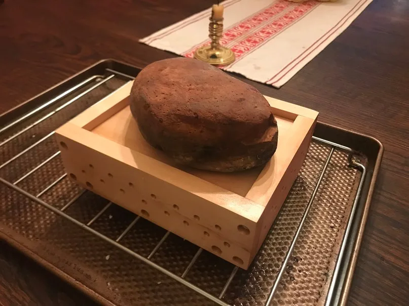 Paneer cheese being pressed
